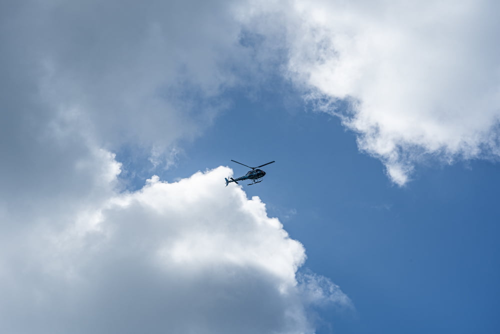 low angle shot helicopter cloudy sky 1